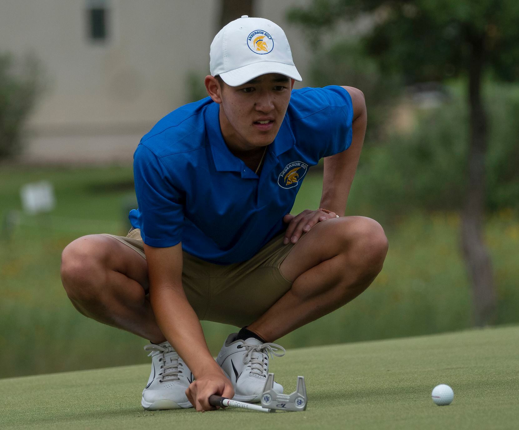 Austin Anderson Keaton Vot lines up a putt on the no.1 green during the final round of UIL...