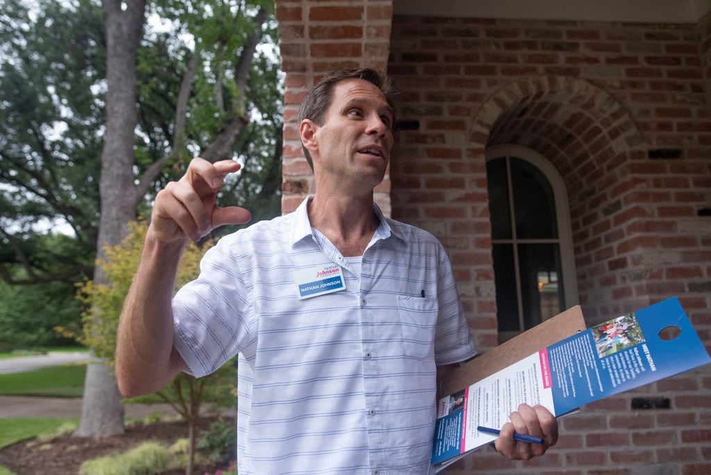 Nathan Johnson talks to a homeowner as he canvassed a neighborhood on Monday, Sept. 3, 2018....