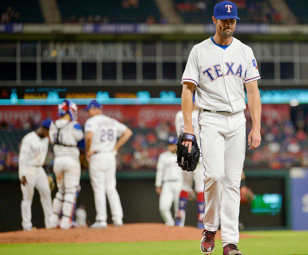 Texas Rangers starting pitcher Cole Hamels (35) is pulled during the sixth inning after...