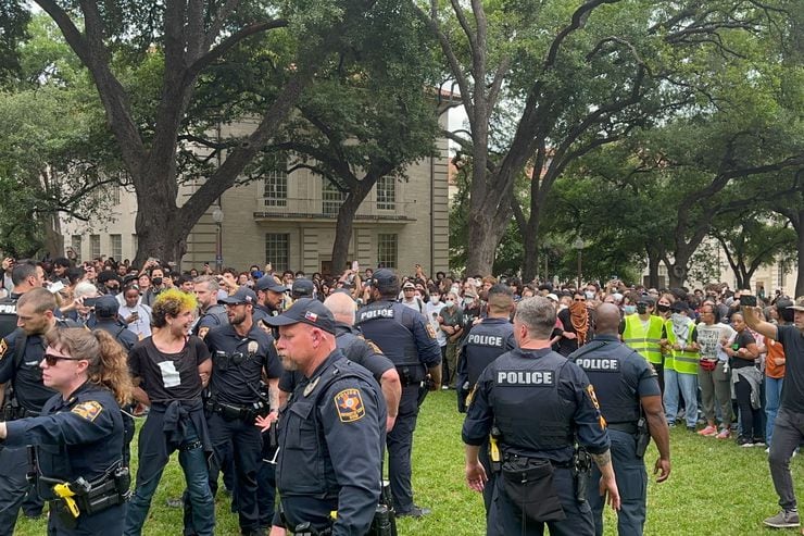 Police and state troopers try to disperse protesters at the University of Texas during a...