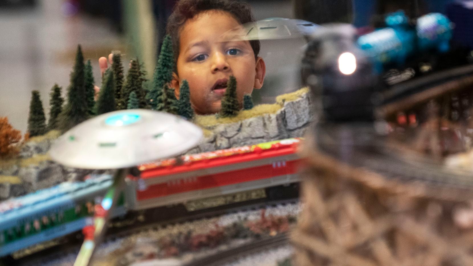 Dylan Patel, 3, watches in awe as the trains roll by while visiting the Trains at NorthPark...