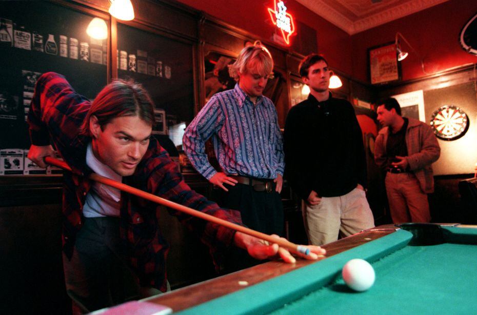In this 1996 photo, Andrew Wilson, left, Owen Wilson, Luke Wilson and Bob Musgrave shoot pool at the Stoneleigh P in Dallas.