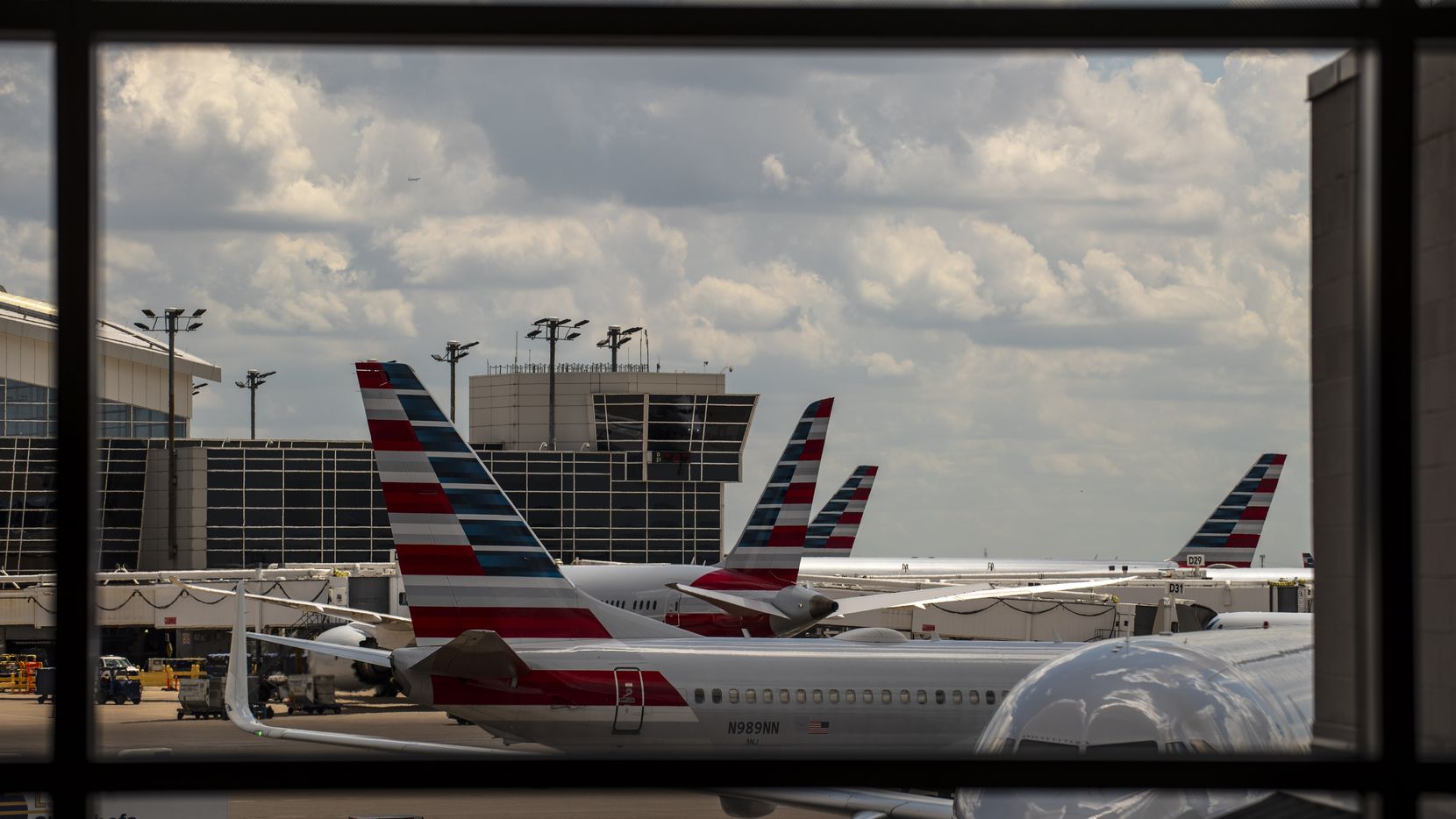 Planes from American Airlines outside of Terminal B at DFW International Airport, on...