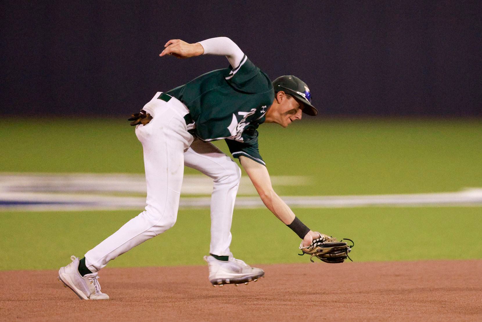 Prosper shortstop Lincoln Skinner (23) catches the ball for an out against Coppell during...