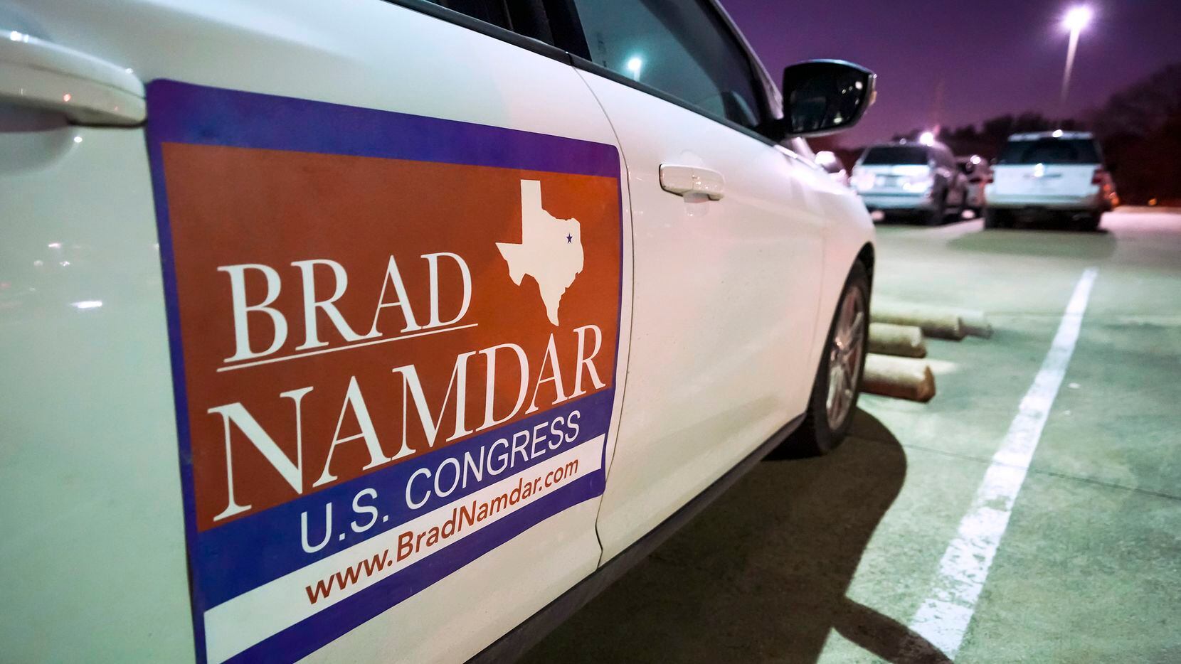 A sign for candidate Brad Namdar is seen on a vehicle during a forum Feb. 9 at the Museum of...