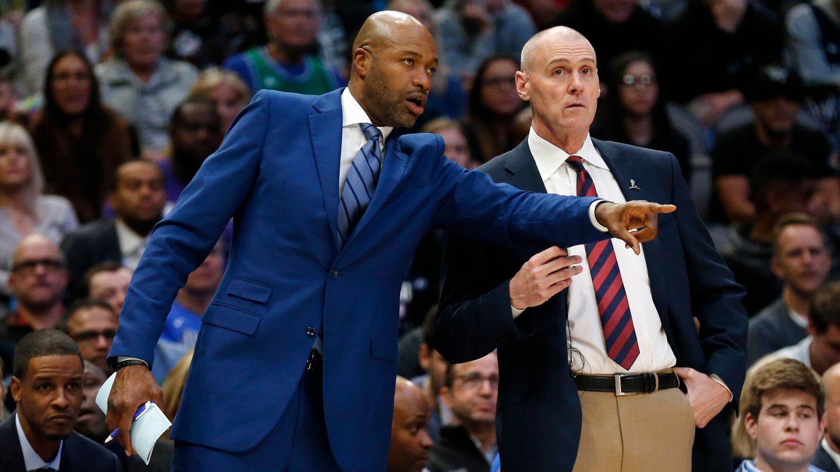 Dallas Mavericks assistant coach Jamahl Mosley talks with head coach Rick Carlisle during the second quarter of play against the Los Angeles Lakers at American Airlines Center in Dallas on Friday, November 1, 2019.