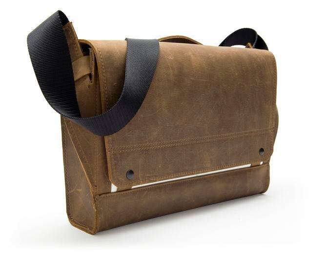 
The Rough Rider Messenger Bag is made of naturally tanned, distressed leather for a...