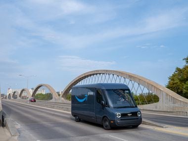 Designed and built in partnership with Rivian, Amazon s first custom electric delivery vehicle was unveiled last fall. Here it is on the Seventh Street bridge in Fort Worth.