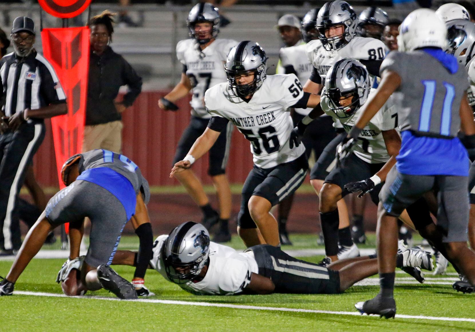 Frisco Panther Creek’s Gary Simms (22) can’t recover his own fumble as Wilmer-Hutchins’...