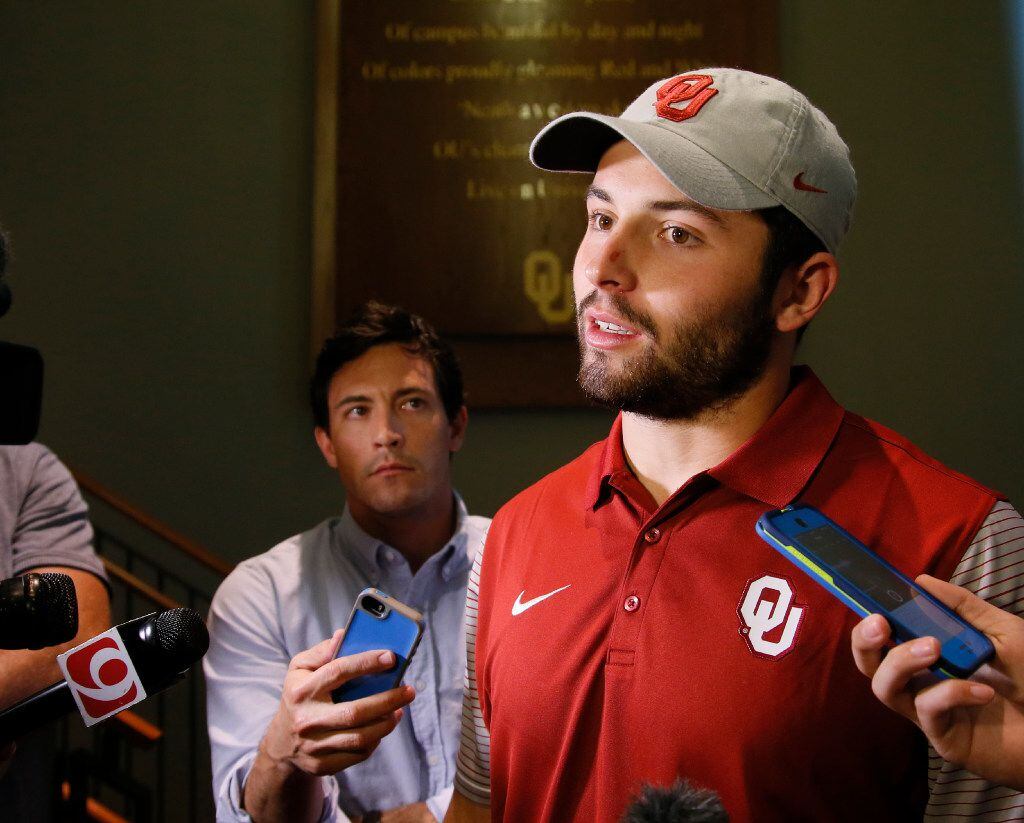 Oklahoma quarterback Baker Mayfield talks with the media following a news conference to...
