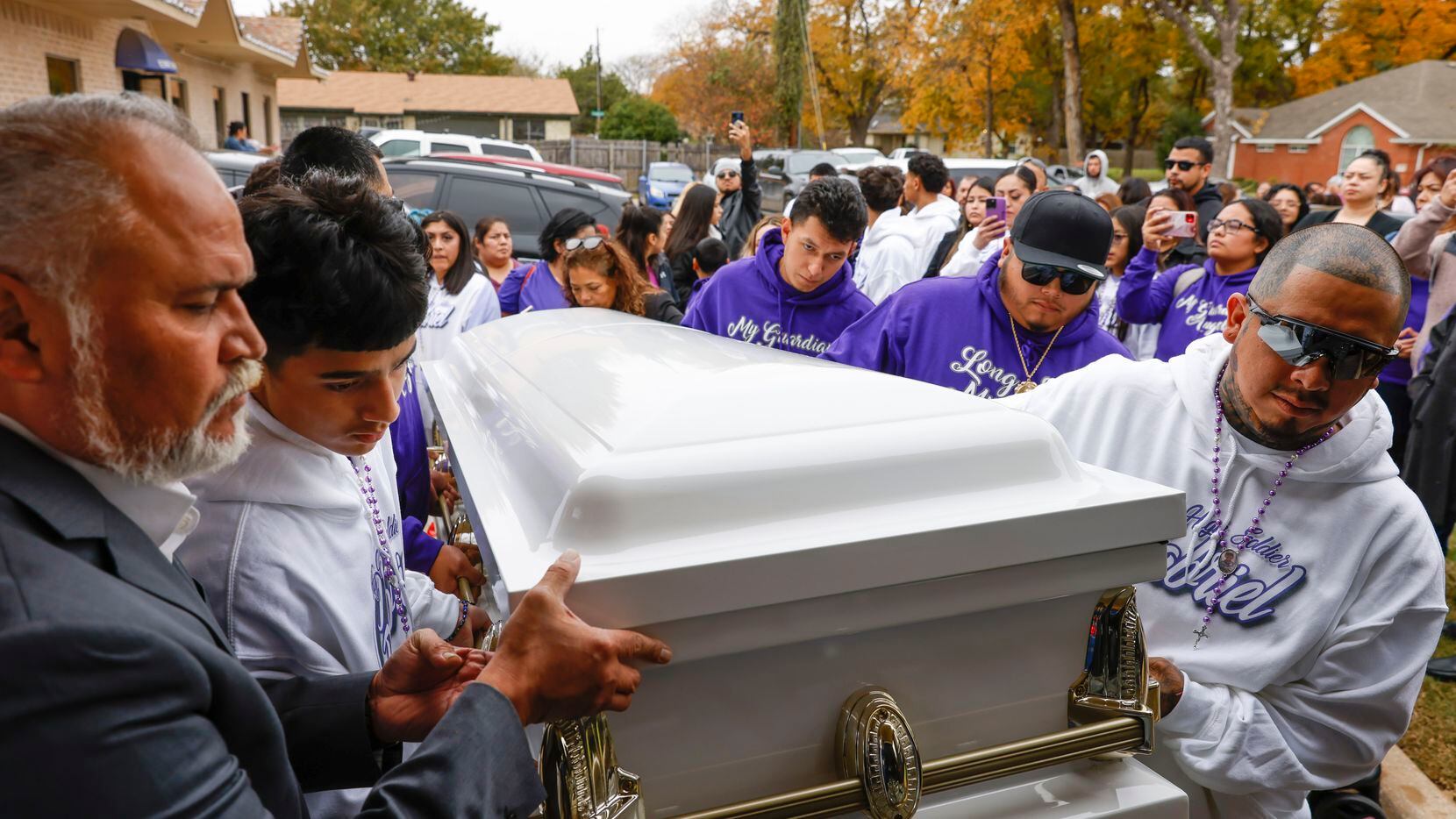 Family members ofGabriel Zamora, 14, including his father Miguel, right, older brother Diego...