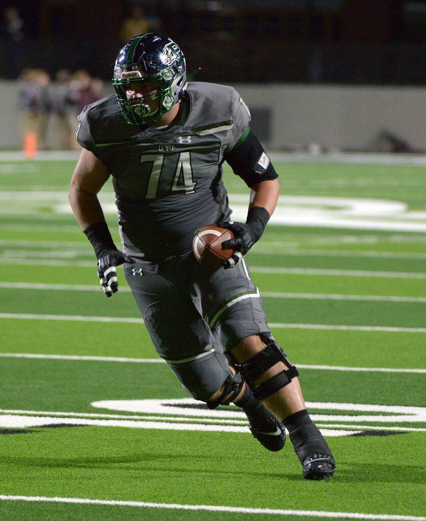 Prosper's Jake Majors (74) catches a touchdown pass in the first quarter of a high school...
