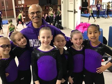 Plano Aerobats head coach Carlos Perez, shown here with several of his students, has retired after more than 30 years of service with the popular city program.