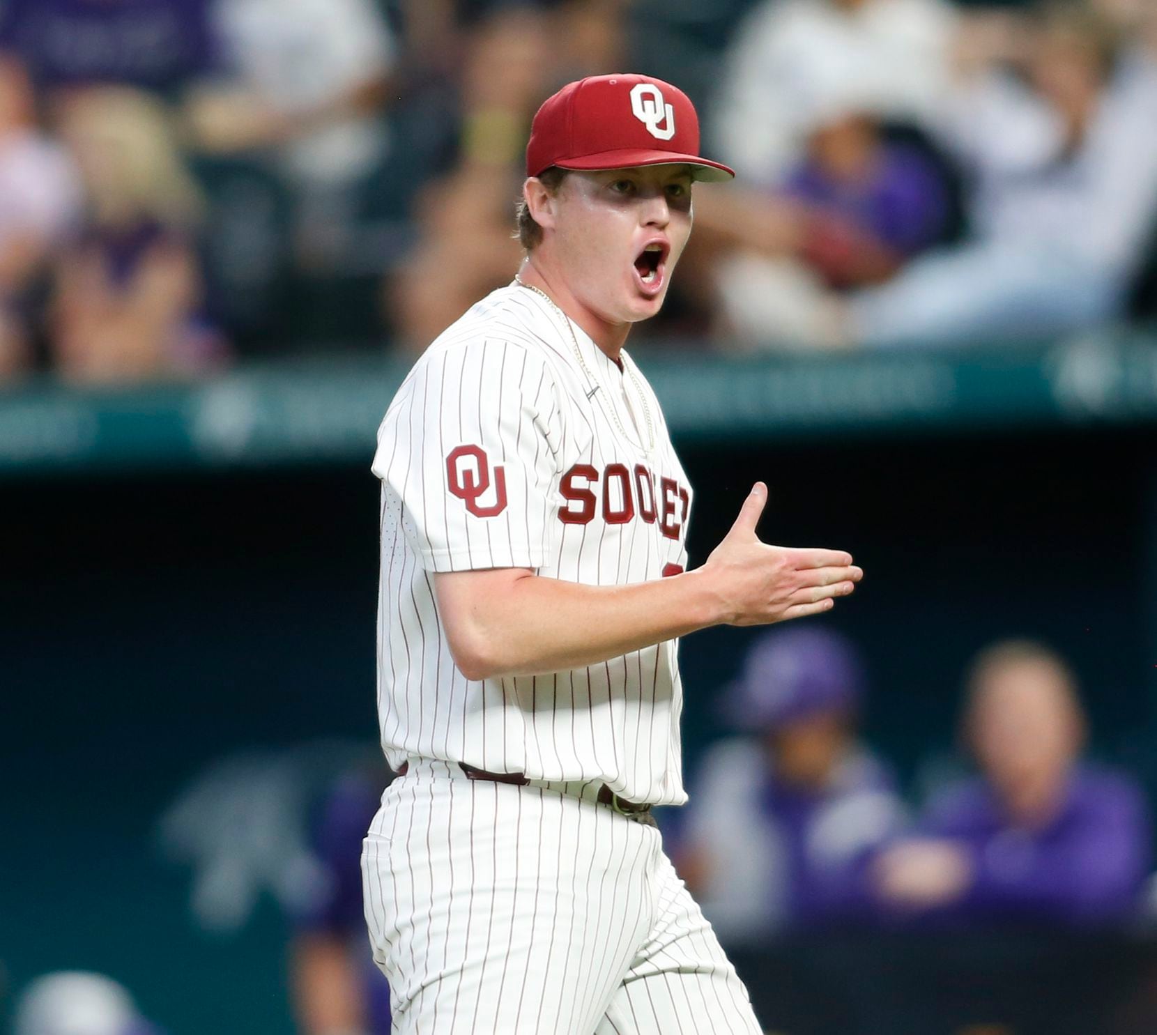 Oklahoma Sooners pitcher Trevin Michael (99) lets out a yell after striking out the final...