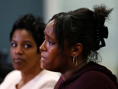 Latasha Nelson speaks during a news conference  alongside her two sons, Trayvon, 14, and...