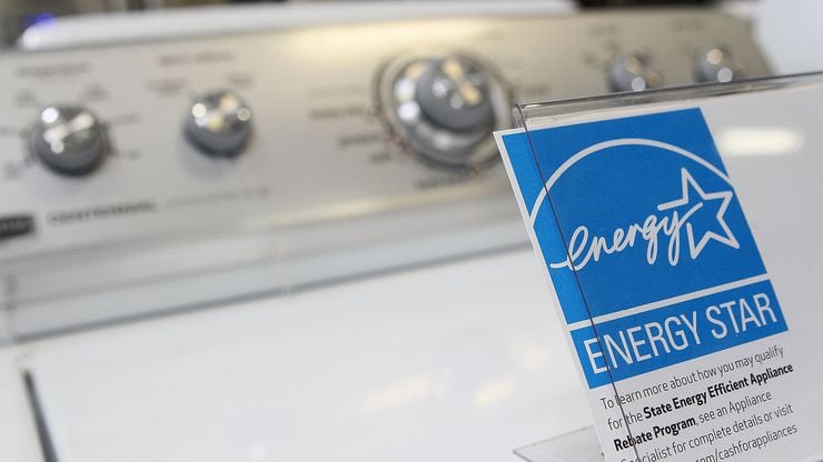 An Energy Star label is displayed on a washing machine at a Best Buy store.