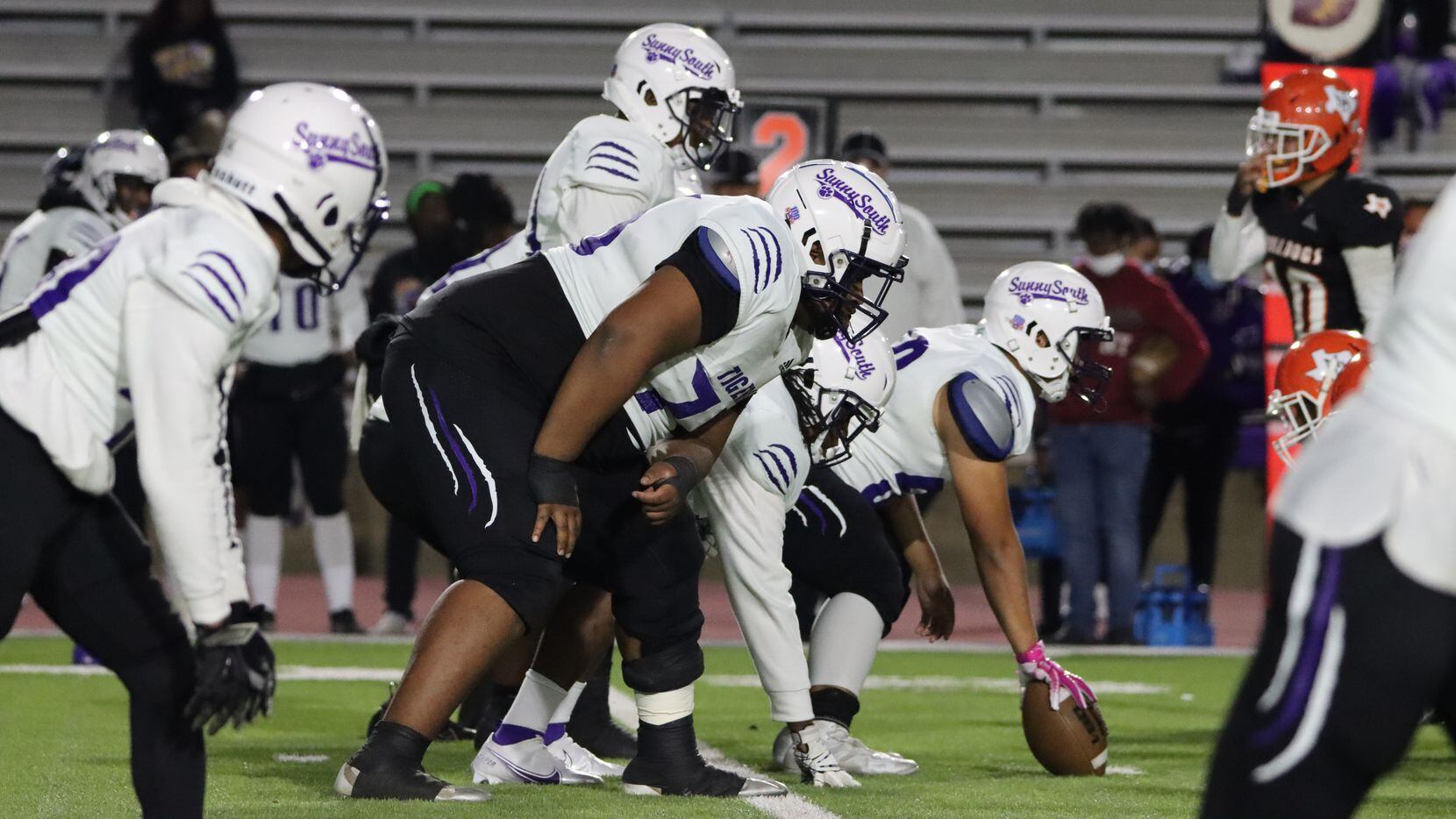 Lincoln offensive guard Jalen Russel (6-foot-4, 400 pounds) gets in his stance before a play...