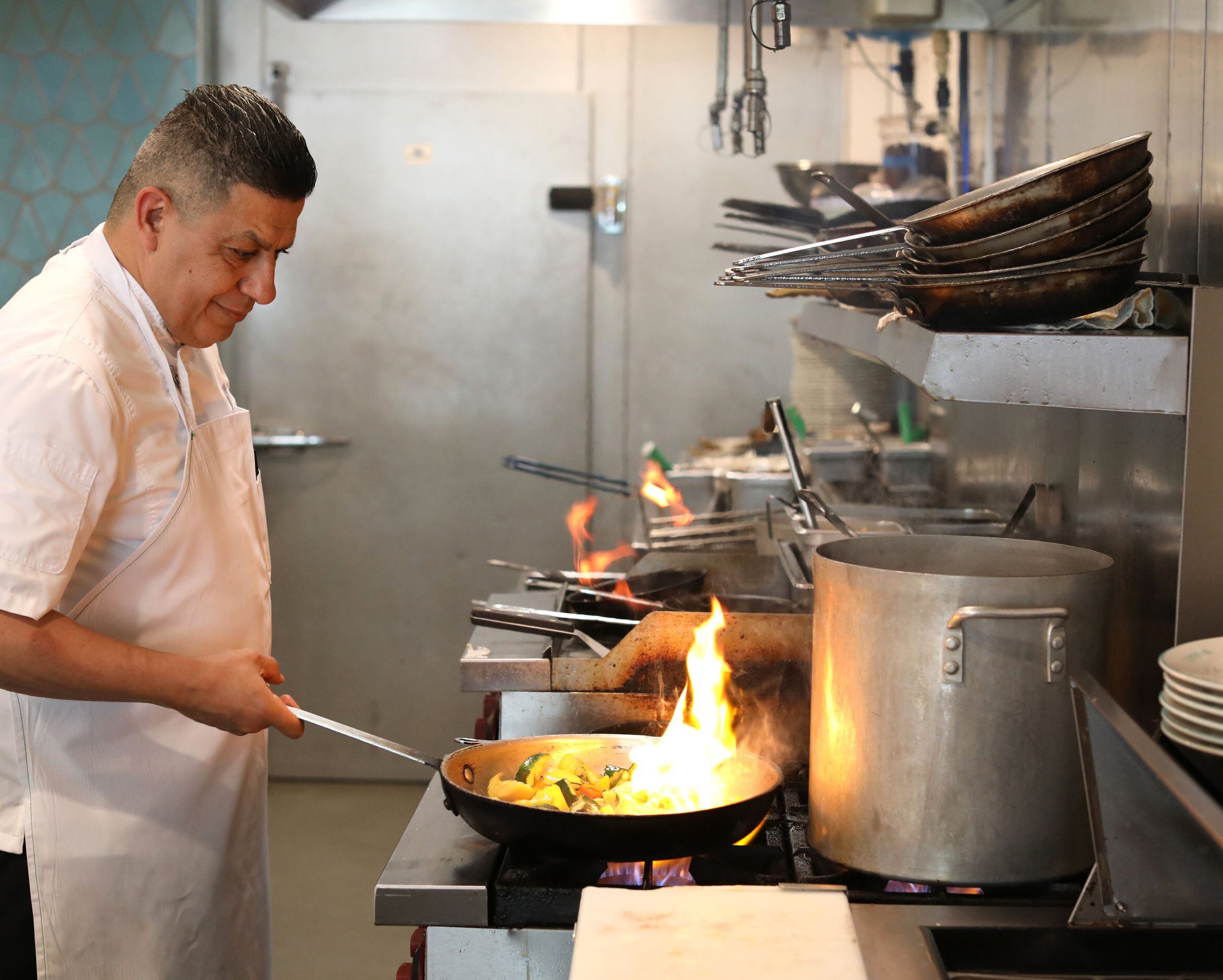 Chef Ameer Ali cooks a meal at Darna in Plano.