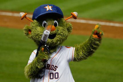 Houston Astros mascot Orbit shoots T-shirts into the crowd at