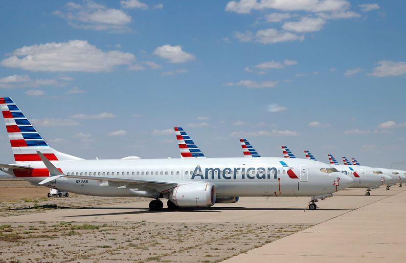Eight of about a dozen grounded American Airlines Boeing 737 Max 8 aircraft are parked on a...