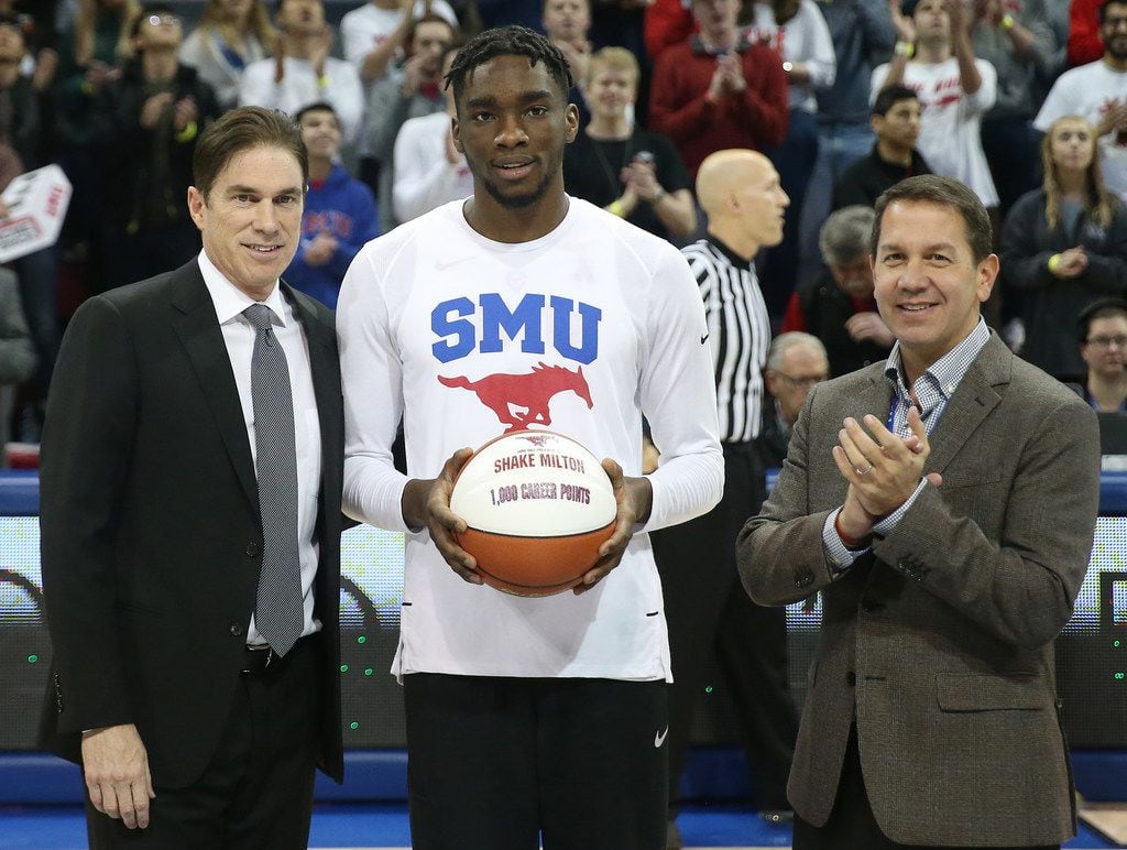 SMU guard Shake Milton (1) receives a commemorative ball denoting 1,000 career points from...