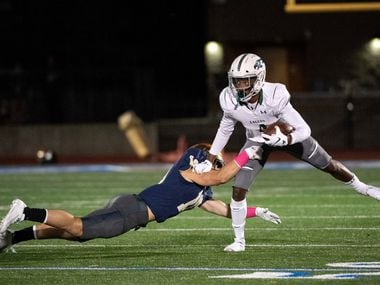Prosper sophomore wide receiver Tyler Bailey (4) escapes the tackle of Jesuit senior linebacker Mitchell Campbell (10) in the first half of a high school football game on Friday, October 11, 2019 at Postell Stadium in Dallas. (Jeffrey McWhorter/Special Contributor)