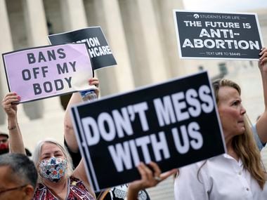 Activists for and against abortion rights protest outside the Supreme Court on Oct. 4, 2021.