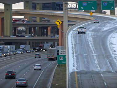 The Interstate Highway 635 exit is covered with the ice and snow as traffic on the Highway 75 southbound is backed up miles in Dallas, Friday, Jan. 6, 2017. (Jae S. Lee/The Dallas Morning News)