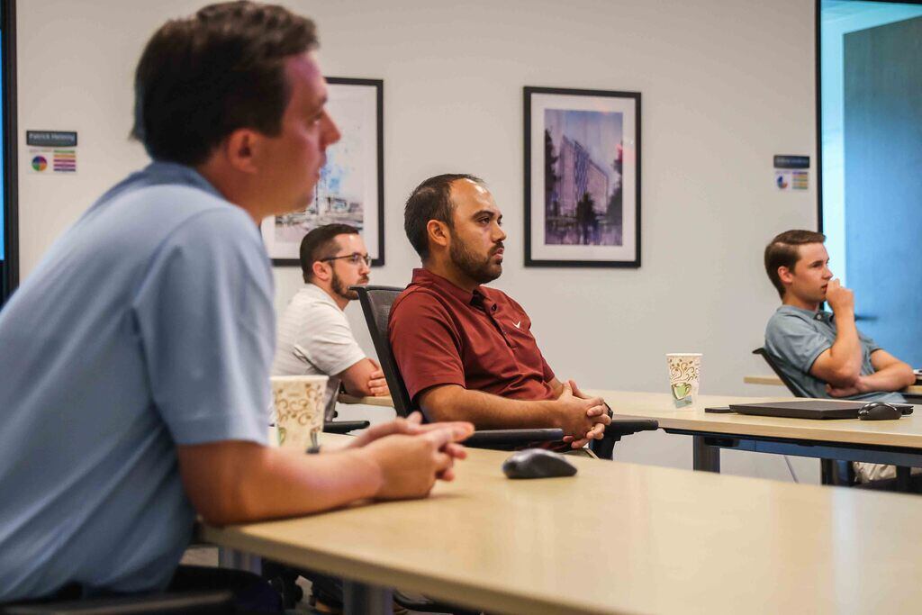 From left: Brasfield & Gorrie staff members Bennett Smrell, Bruce Deupree, Ronnie Hernandez and Josh Tellidero sit in on a preconstruction process workshop in Dallas on Aug. 24.
