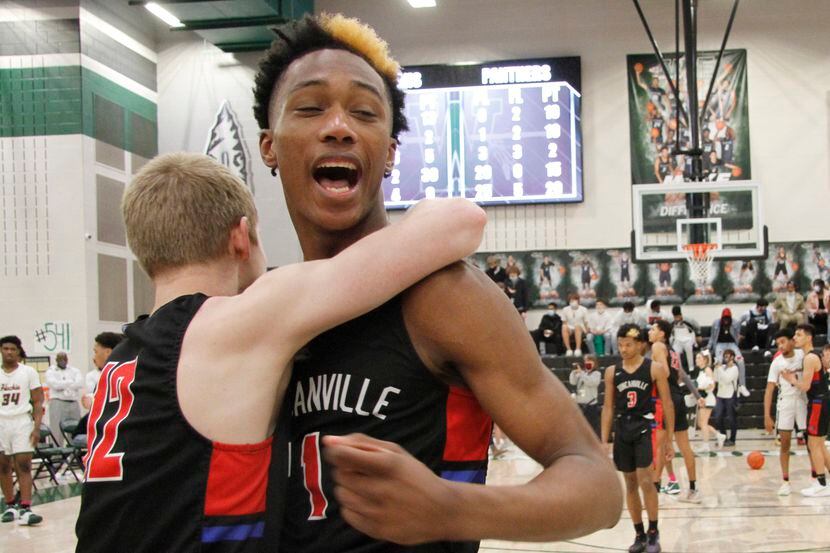 Duncanville's Ronald Holland (right) and teammate Jackson Prince celebrate after a 70-65...