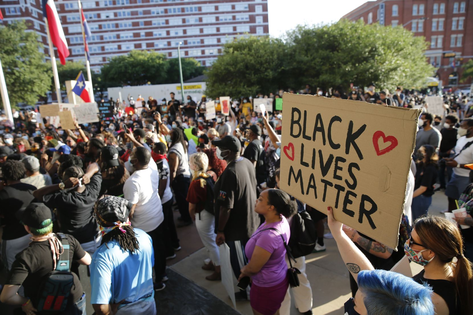 Protesters rally Friday during a demonstration against police brutality near downtown...