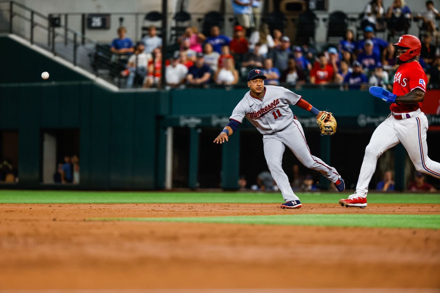 Minnesota Twins second baseman Jorge Polanco (11) throws the ball to second base to make an...