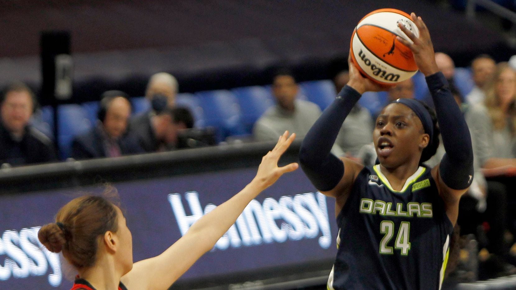 Dallas Wings guard Arike Ogunbowale (24) puts up a jump shot over the defense of Las Vegas center JiSu Park (19) during second half action. Las Vegas defeated Dallas 95-79. The two WNBA teams played their game at College Park Center on the campus of UT-Arlington on July 11, 2021. (Steve Hamm/ Special Contributor)