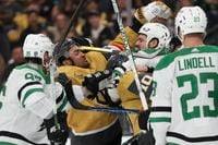 Vegas Golden Knights left wing William Carrier (28) and center Nicolas Roy (10) fight Dallas...