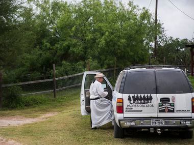  Father Roy Snipes climbs into his white Chevy Suburban after a boat ride on the Rio Grande.