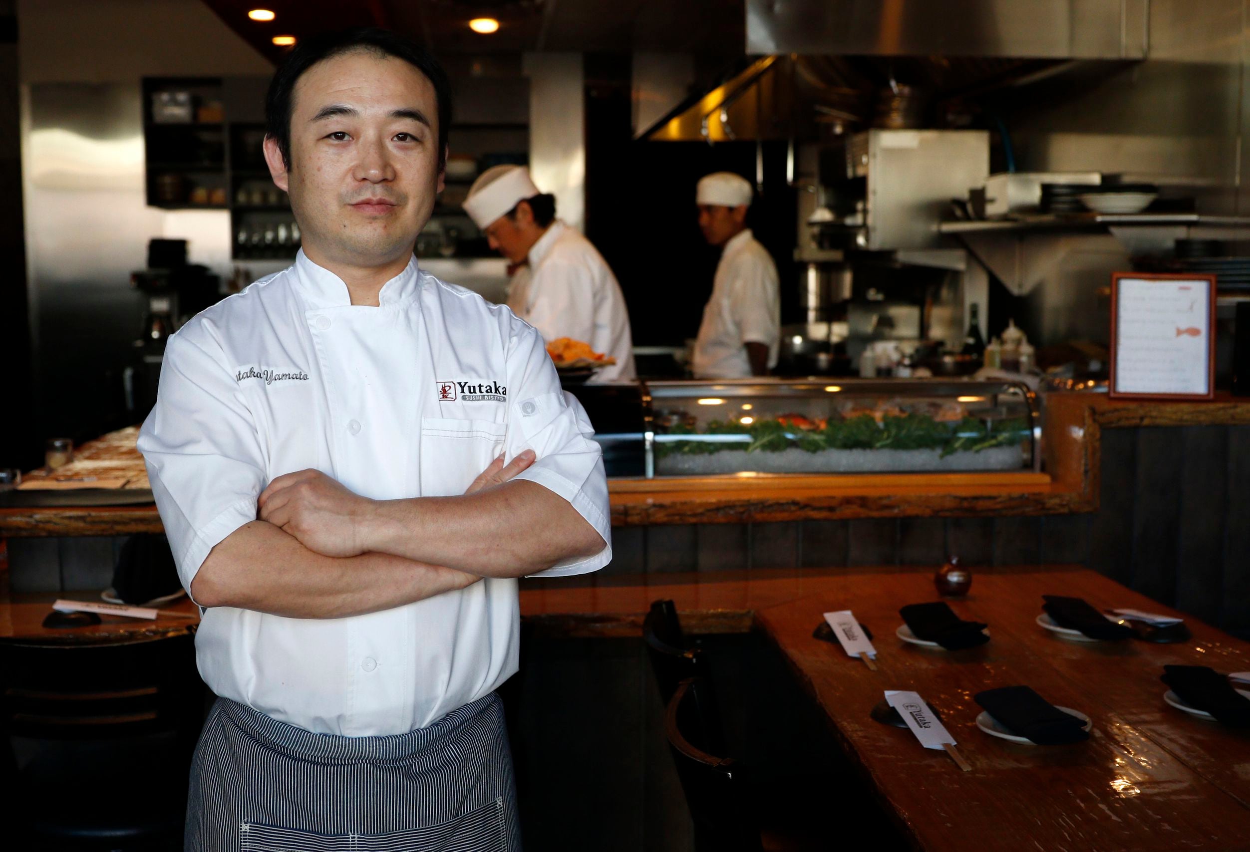 Chef Yutaka Yamato poses for a photograph at his Yutaka Sushi Bistro in Dallas on March 25,...