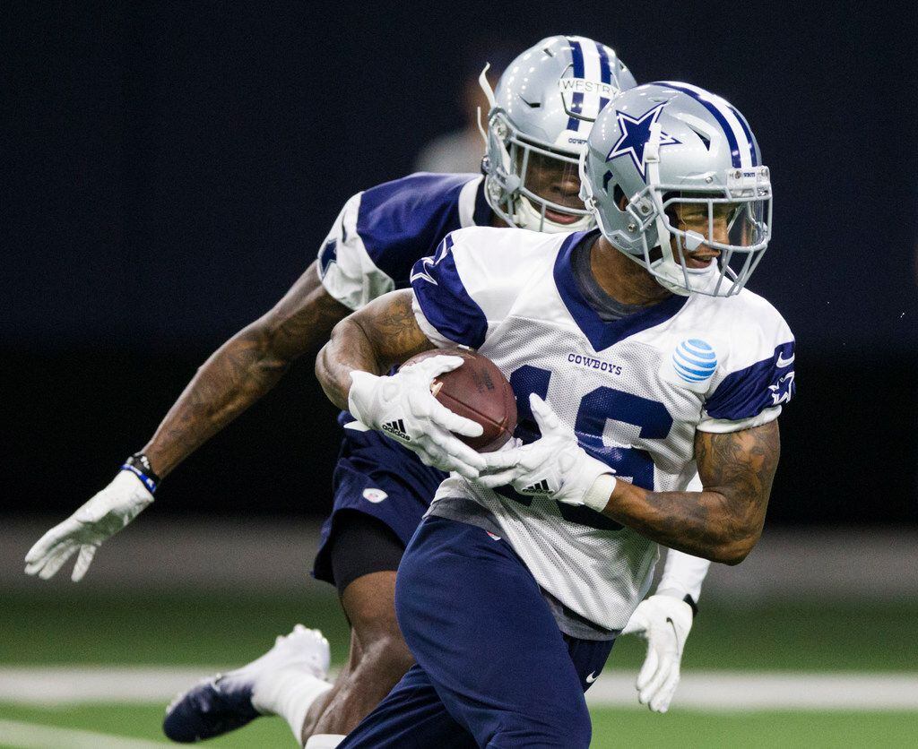 FILE - Cowboys wide receiver Cedrick Wilson (16) runs past cornerback Chris Westry (39) during OTAs on Wednesday, May 29, 2019, at The Star in Frisco. (Ashley Landis/The Dallas Morning News)