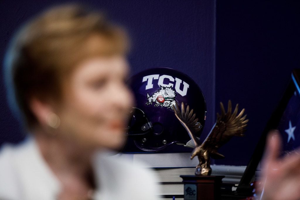 A TCU football helmet is on display in Congresswoman Kay Granger's office as she speaks with...