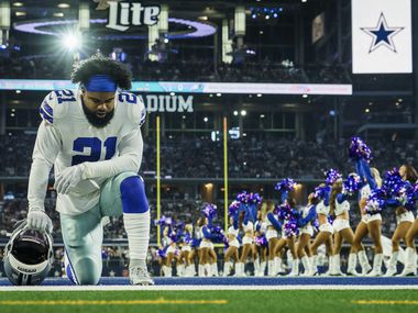 Dallas Cowboys running back Ezekiel Elliott (21) kneels in the end zone before an NFL football game at AT&T Stadium against the Philadelphia Eagles on Sunday, Oct. 20, 2019, in Arlington.