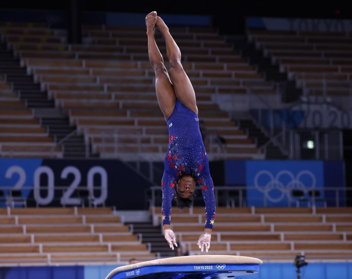 USA’s Simone Biles competes on the vault in a women’s gymnastics event during the postponed...