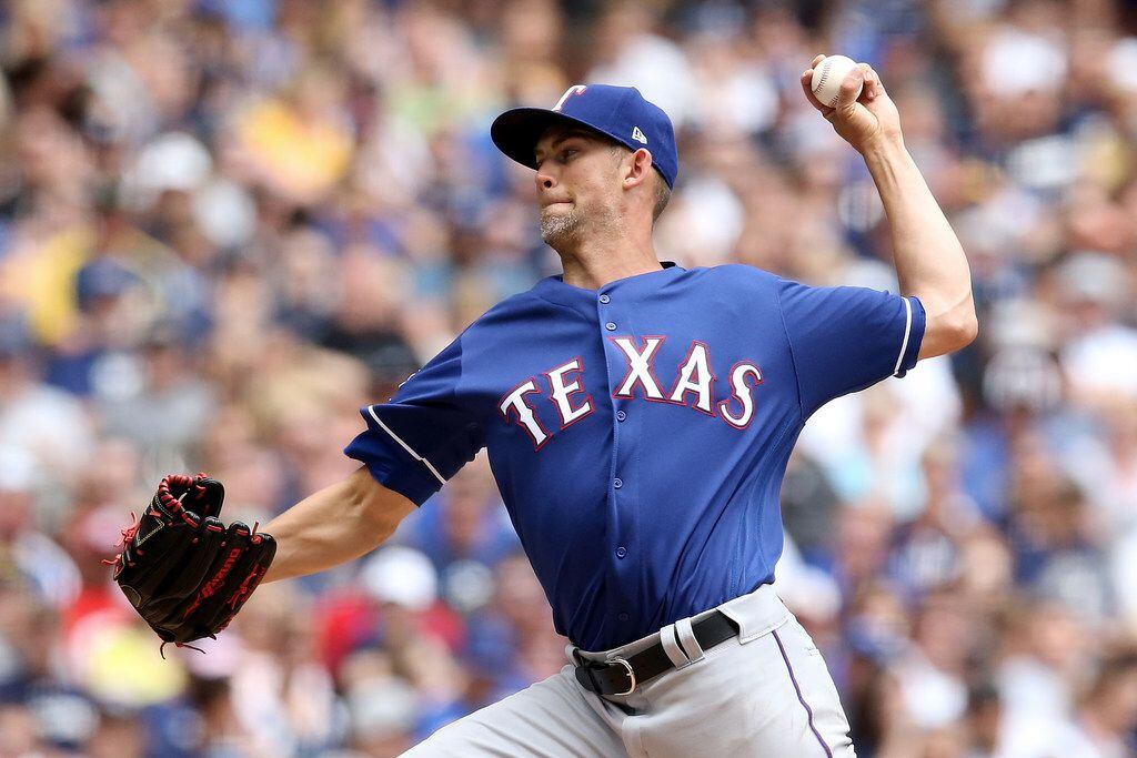 MILWAUKEE, WISCONSIN - AUGUST 11:  Mike Minor #23 of the Texas Rangers pitches in the second...
