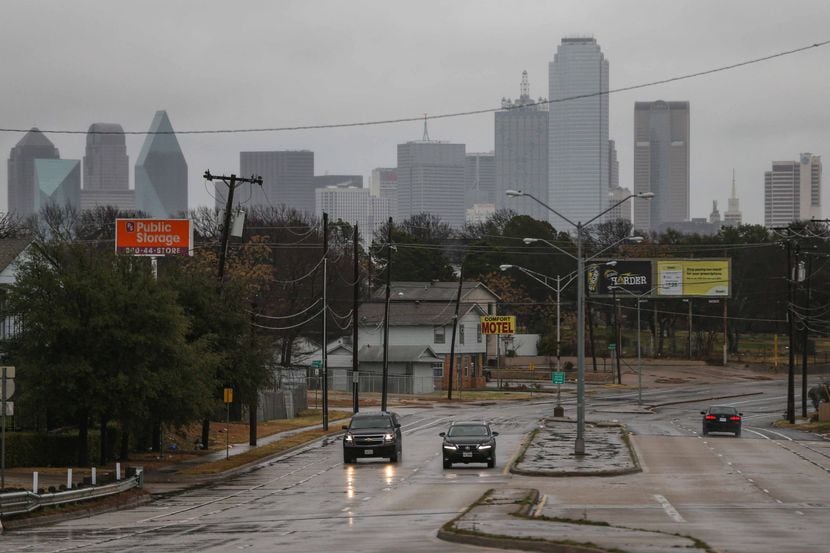 Motorists drove along rain-slicked Fort Worth Avenue and Vilbog Road in Dallas in December.