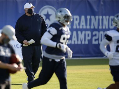 Dallas Cowboys head coach Mike McCarthy watches the team practice during the first day of training camp at Dallas Cowboys headquarters at The Star in Frisco, Texas on Friday, August 14, 2020.