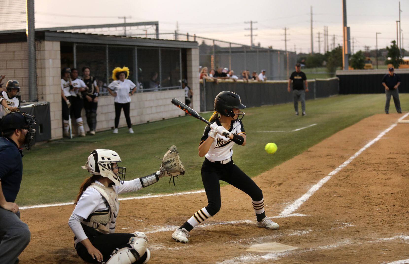Frisco Memorial High School #4, Emily Bustillos, misses a strike during a softball game...