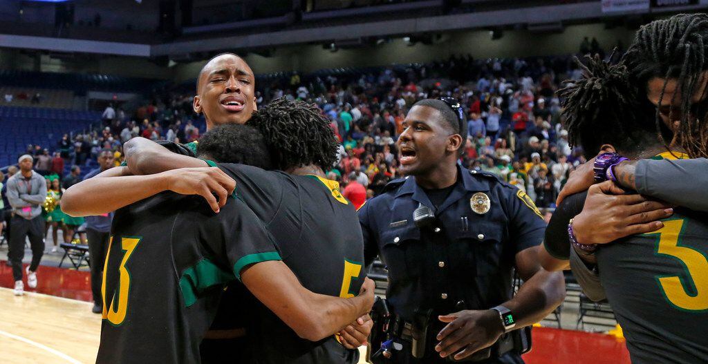 Madison players hug with tear of joy after defeating Brock in 3A  final. UIL boys basketball 3A State Final between Brock and Dallas Madison on Saturday March 9, 2019 at the Alamodome in San Antonio, Texas. (Ron Cortes/ Special Contributor) 