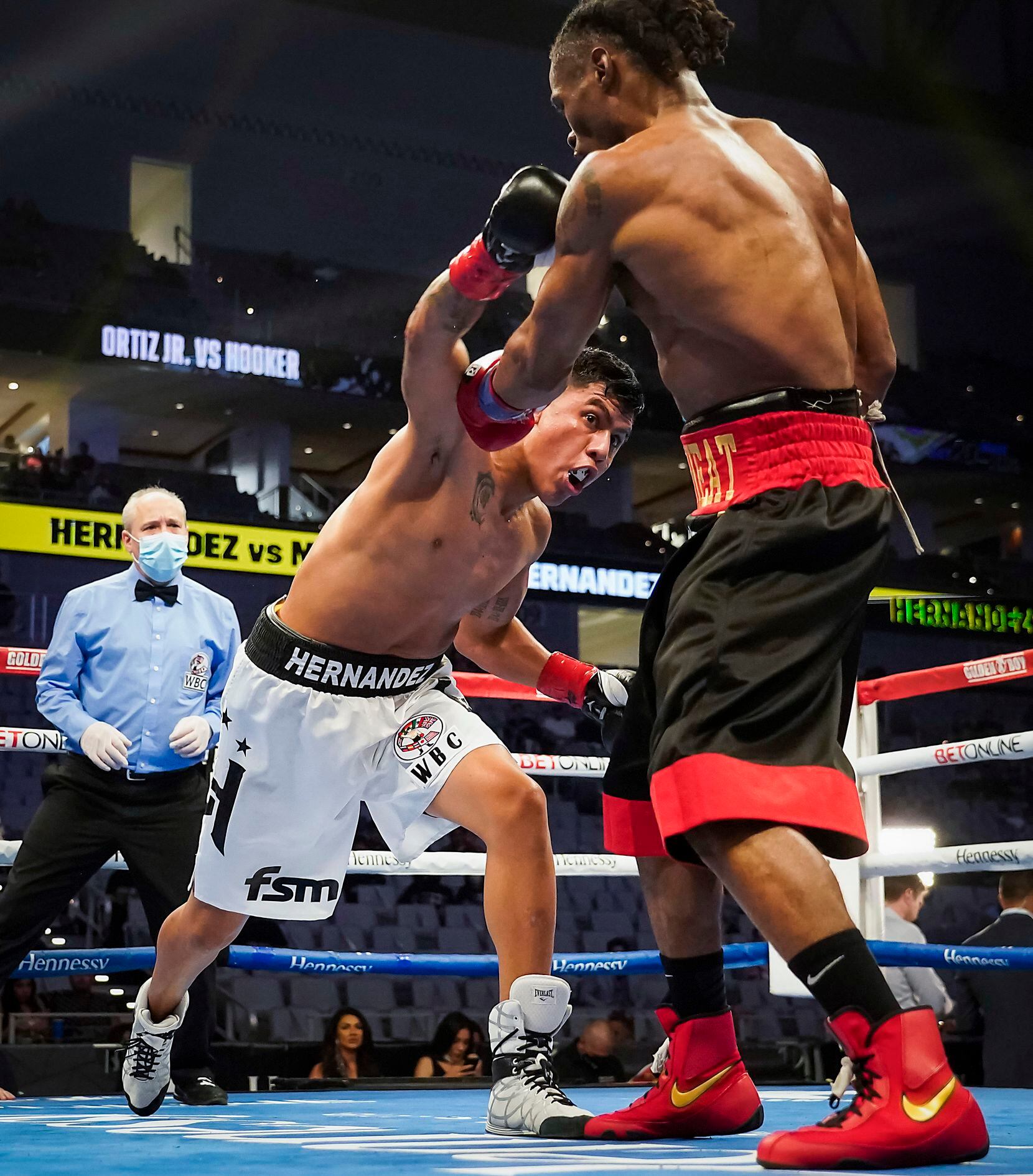 Luis Hernandez (left) fights Alex Martin in a super lightweight bout at Dickies Arena on Saturday, March 20, 2021, in Fort Worth.