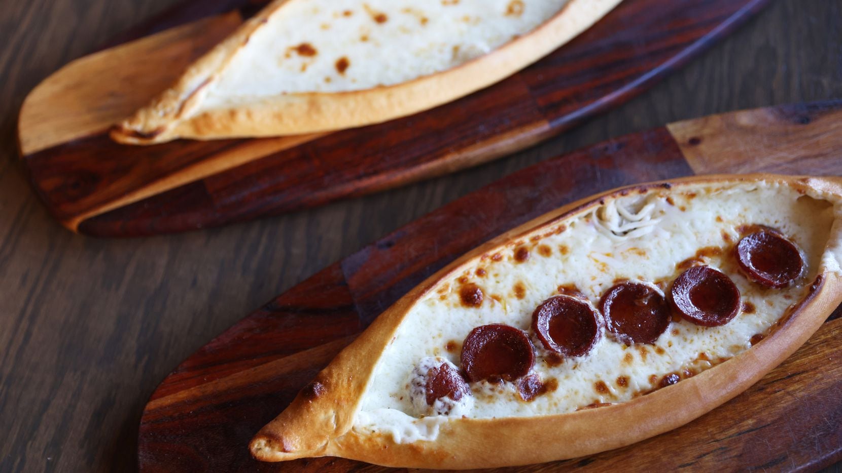 Lezzet Cafe offers several versions of pide, or Turkish pizza, including kasarli, which is...