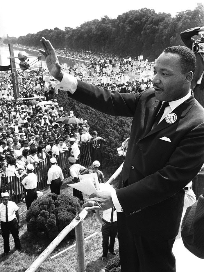  US civil rights leader Martin Luther King, Jr. waves to supporters in this August 28, 1963,...