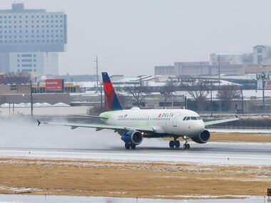 A plane with Delta Air Lines takes off at Dallas Love Field Airport in Dallas on Wednesday,...