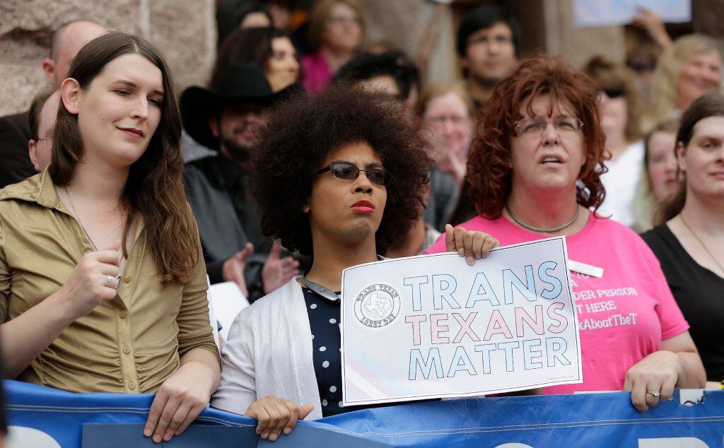 Members of the transgender community take part in a rally on the steps of the Texas Capitol,...